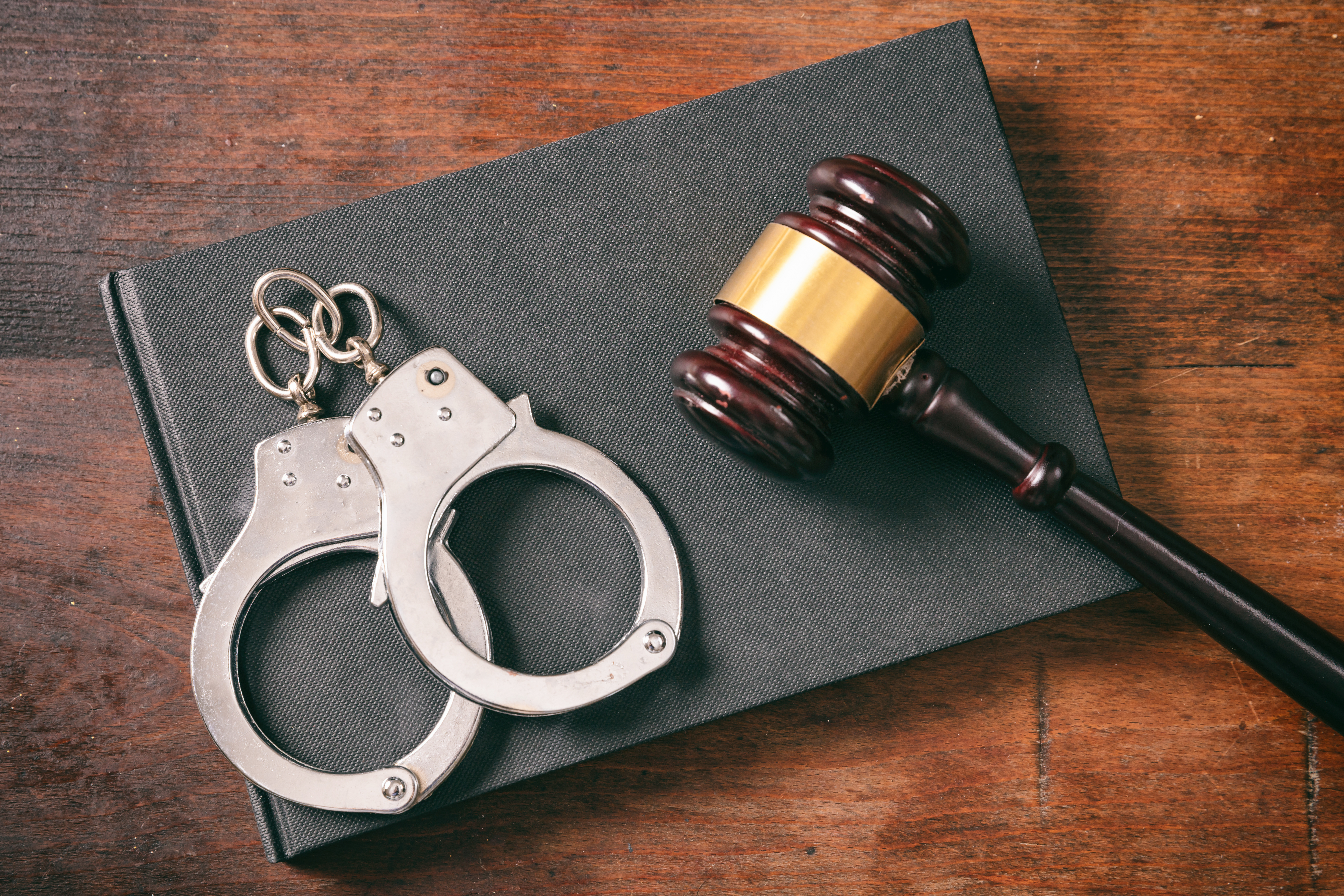 handcuffs gavel criminal record arrest