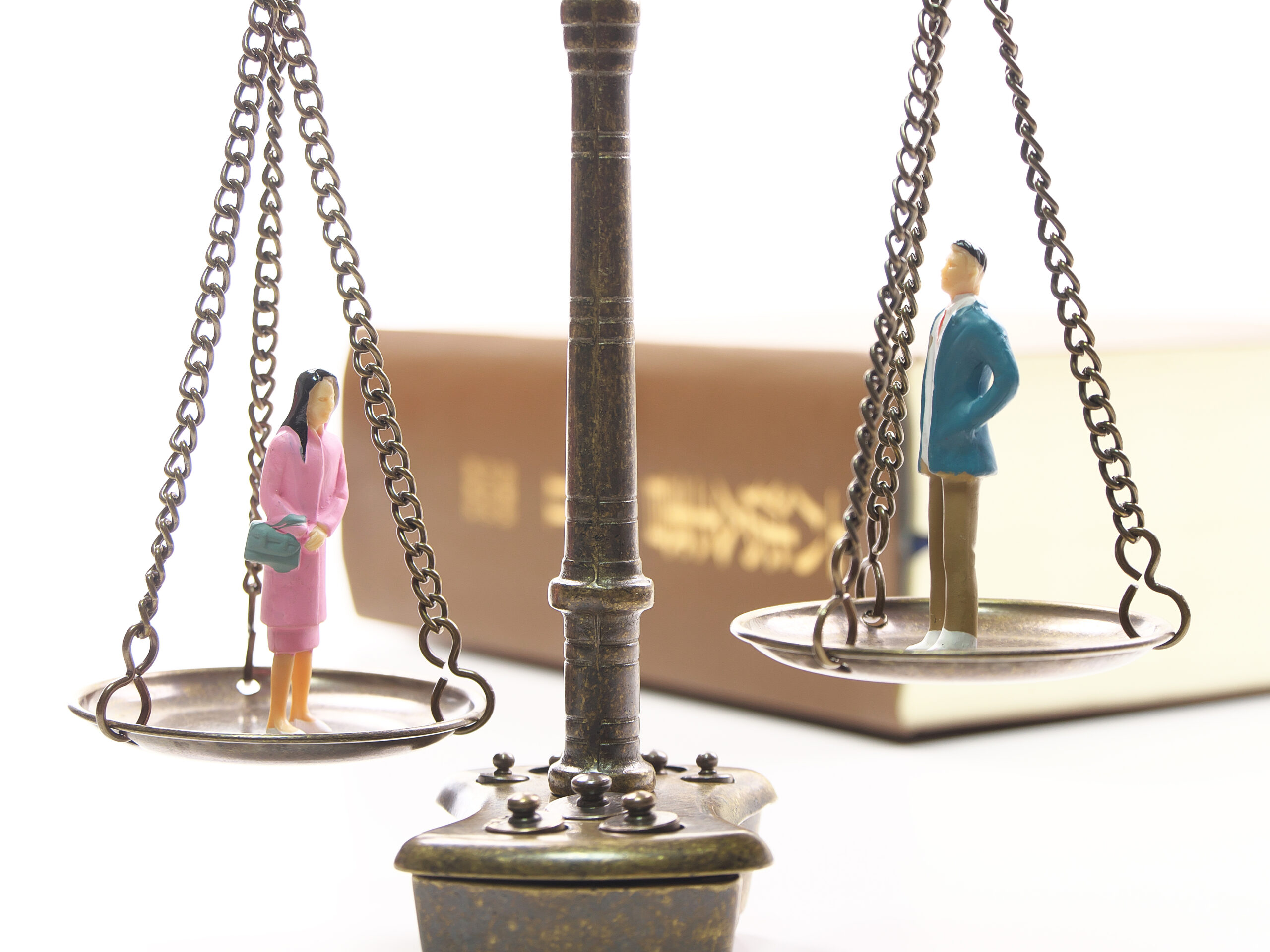 little people on scales of justice