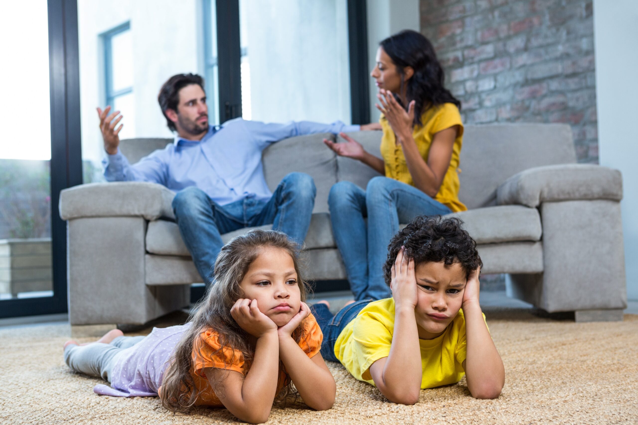 parents fighting children on floor