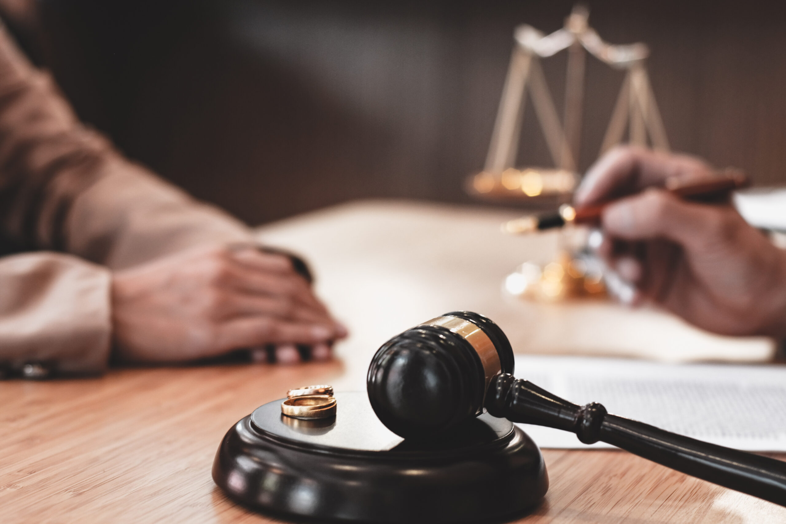 Judge gavel deciding on marriage divorce signing papers. lawyer concept.