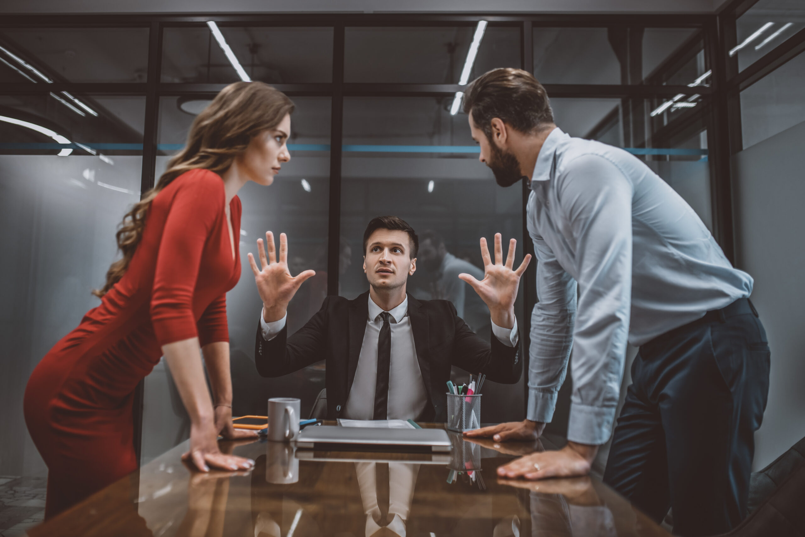 Hot argument. A mediator trying to stop the argument between spouses