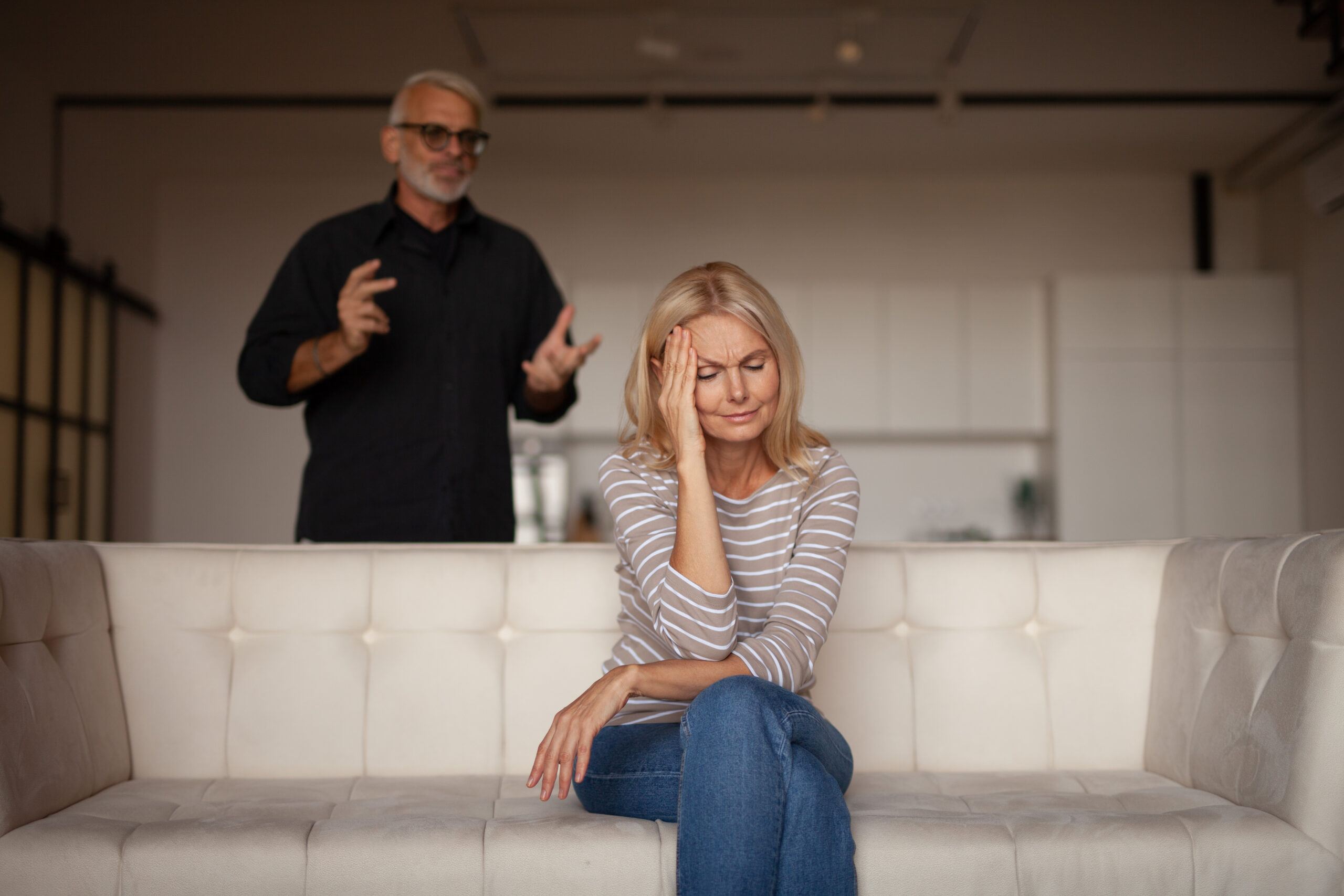Quarrel of a mature couple at home.