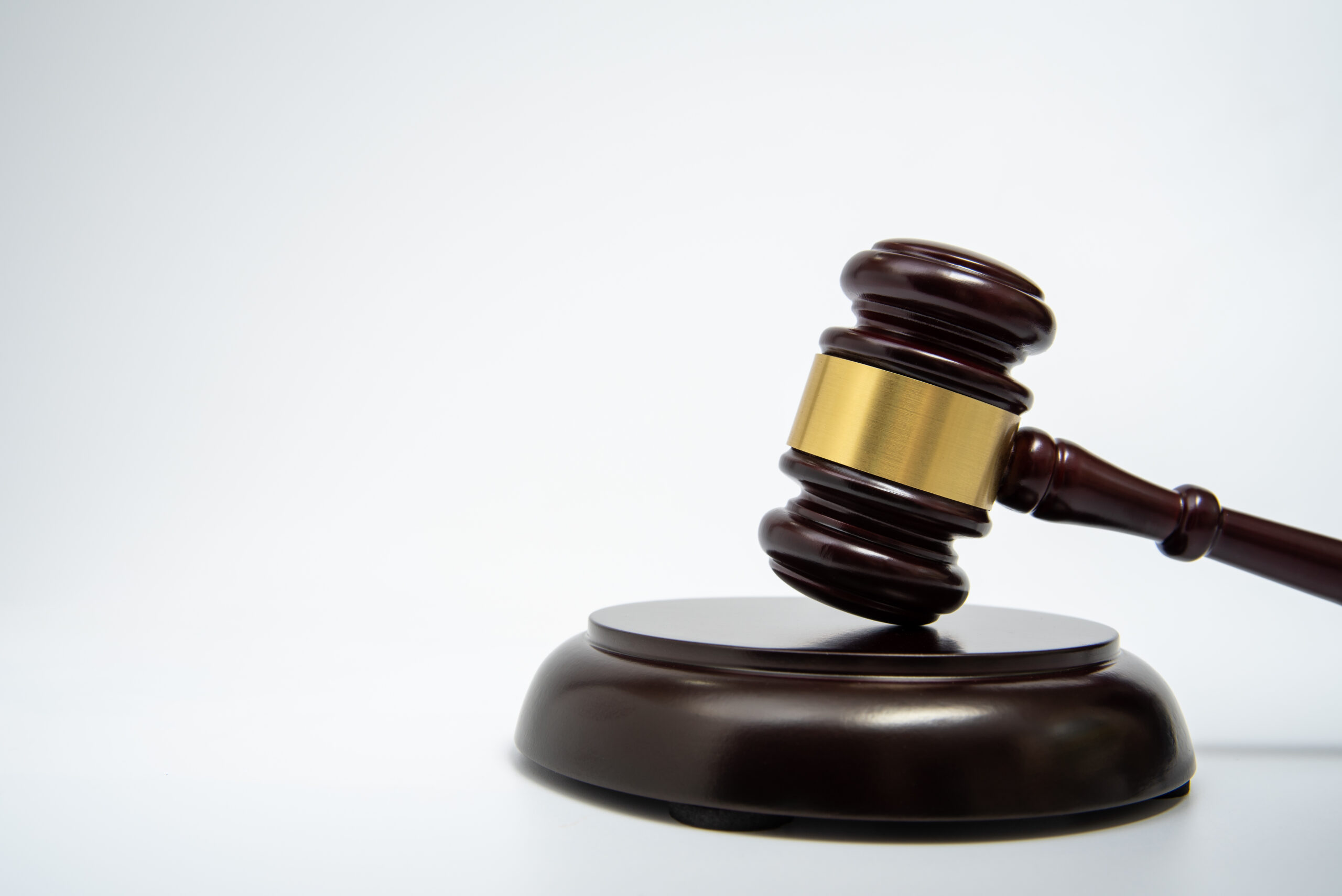 A wooden judge gavel isolated on white background