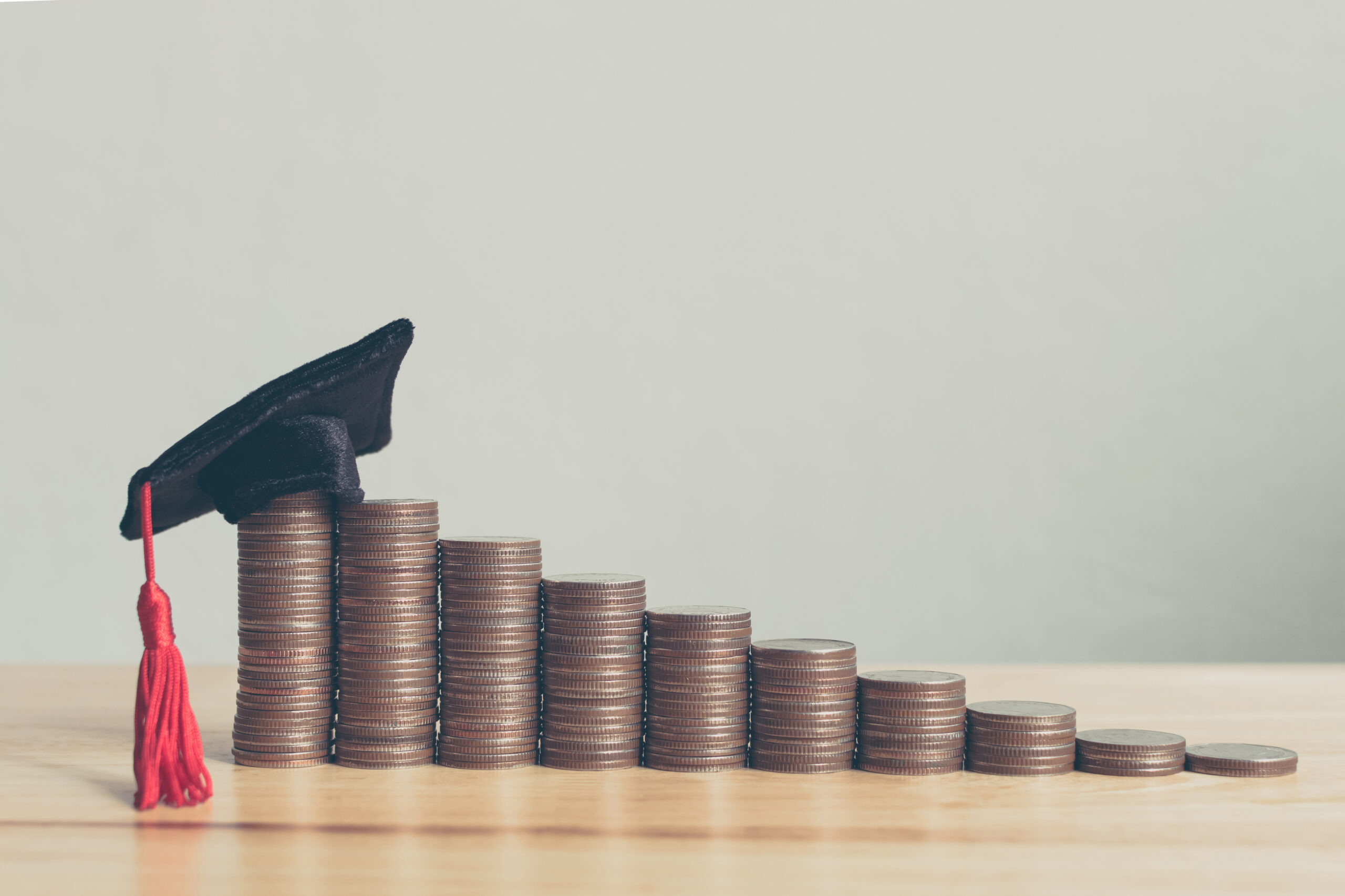 Scholarship money concept. Coins stack step growing growth saving money investment.